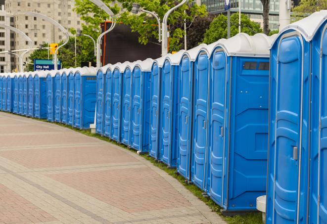 a row of portable restrooms at a trade show, catering to visitors with a professional and comfortable experience in Trenton